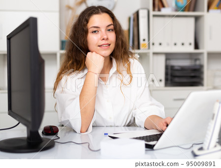 Portrait of young female office worker Portrait of young female office worker 95009891