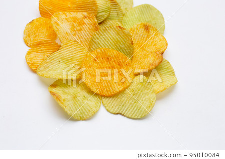 Potato chips on white background. Potato chips on white background. 95010084