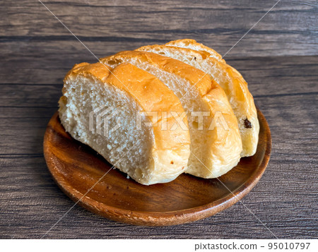Whole grain bread ready to eat on the wooden background 95010797