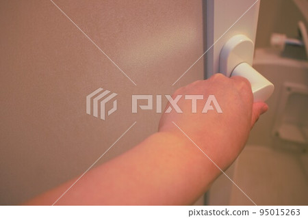 Bathtub door Door handle Shower room door Woman's hand and door 95015263