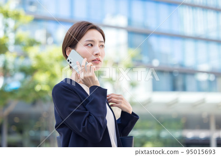 Portrait of a woman calling on a business smartphone 95015693