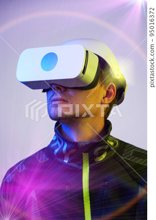 Man is using virtual reality headset. Concept of virtual, augmented and extended reality and metaverse. 95016372