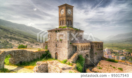 Panoramic view to Gjirokastra castle with the wall, tower and Clock, Gjirokaster, Albania Panoramic view to Gjirokastra castle with the wall, tower and Clock, Gjirokaster, Albania 95017543