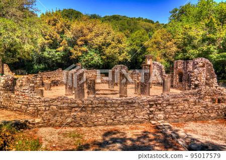 Panoramic view to Remains of the baptistery ruins of ancient town of Butrint , Sarande, Albania Panoramic view to Remains of the baptistery ruins of ancient town of Butrint , Sarande, Albania 95017579