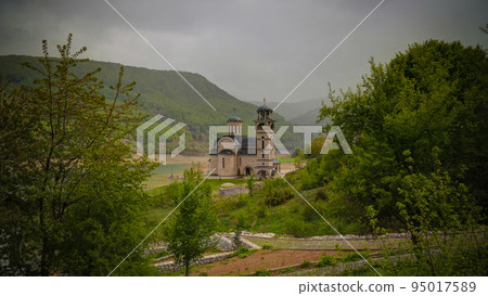 Landscape of Mavrovo national park with mountain,lake and new St Nikola church, FYR Macedonia Landscape of Mavrovo national park with mountain,lake and new St Nikola church, FYR Macedonia 95017589