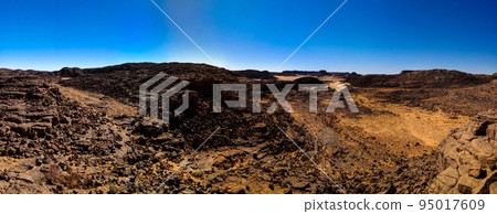 Aerial panoramic view to El Berdj mountain and erg gorge in Tassili nAjjer national park, Algeria Aerial panoramic view to El Berdj mountain and erg gorge in Tassili nAjjer national park, Algeria 95017609