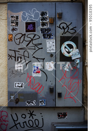 Dirty landscape with graffiti on buildings in the city center Breach of etiquette Nuisance 95018395