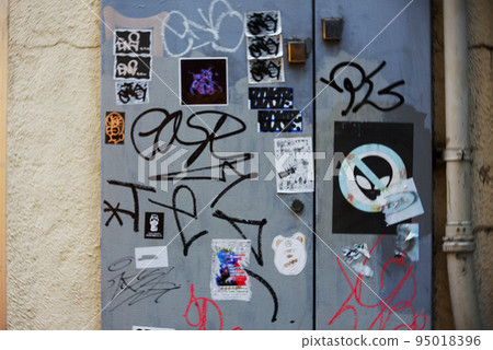 Dirty landscape with graffiti on buildings in the city center Breach of etiquette Nuisance Dirty landscape with graffiti on buildings in the city center Breach of etiquette Nuisance 95018396