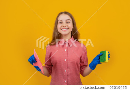 happy cheerful child in rubber gloves with sponge on yellow background happy cheerful child in rubber gloves with sponge on yellow background 95019455