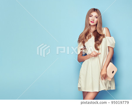 Blonde young woman in floral spring summer dress Blonde young woman in floral spring summer dress 95019779