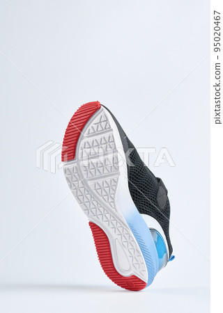 Trendy fashionable sneakers with sole on white background. Stylish sports casual shoes. Creative minimalistic layout with footwear 95020467