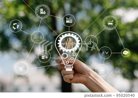 Hand holding light bulb with green background. idea solar energy in nature concept in virtual icon screen Icon. Hand holding light bulb with green background. idea solar energy in nature concept in virtual icon screen Icon. 95020540