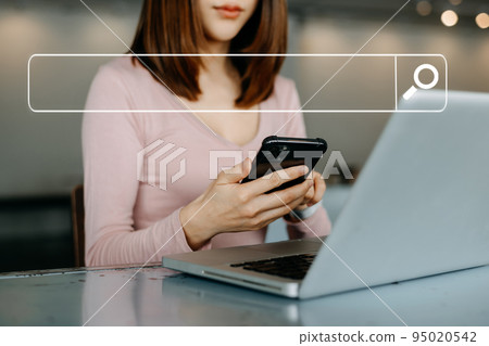 Searching Browsing Internet Data Information Networking Concept with blank search bar.man working with mobile phone and laptop computer VR icon in office. Searching Browsing Internet Data Information Networking Concept with blank search bar.man working with mobile phone and laptop computer VR icon in office. 95020542