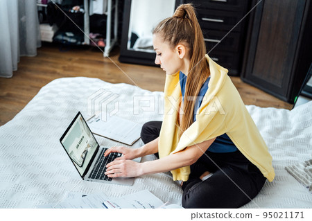 Job Search Career Recruitment Hiring Website Concept. Young woman in home browsing work opportunities online using job search web sites and applications Job Search Career Recruitment Hiring Website Concept. Young woman in home browsing work opportunities online using job search web sites and applications 95021171