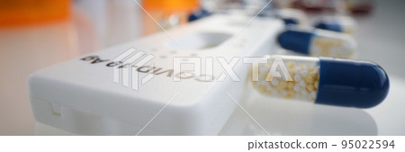 Express test for covid 19 antigen lying among many medical capsules closeup Express test for covid 19 antigen lying among many medical capsules closeup 95022594