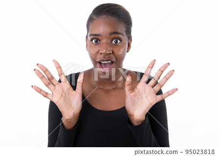 Portrait of excited African American woman showing palms 95023818