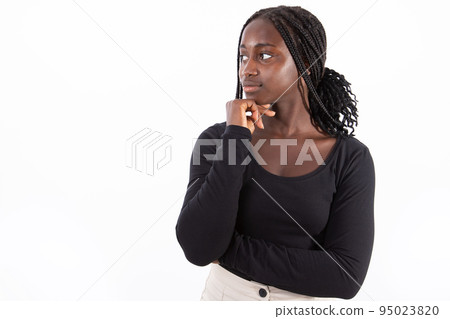 Portrait of thoughtful young woman looking away and smiling Portrait of thoughtful young woman looking away and smiling 95023820