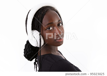 Close-up of positive young woman posing in headphones 95023825