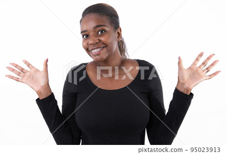Portrait of happy young African American woman with open palms Portrait of happy young African American woman with open palms 95023913