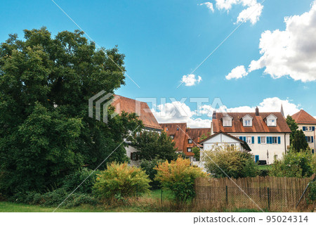 Traditional small house with beautiful outdoor decor facade in Germany. German old brick building house ancient European city German architect Traditional small house with beautiful outdoor decor facade in Germany. German old brick building house ancient European city German architect 95024314