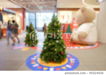 Abstract blur christmas tree background or defocused shopping mall of department store. Abstract blur christmas tree background or defocused shopping mall of department store. 95024836