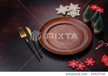 Christmas decoration elements as well as gingerbread on a brown concrete background Christmas decoration elements as well as gingerbread on a brown concrete background 95025540