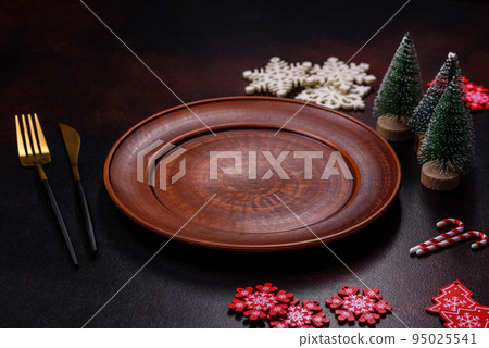 Christmas decoration elements as well as gingerbread on a brown concrete background Christmas decoration elements as well as gingerbread on a brown concrete background 95025541