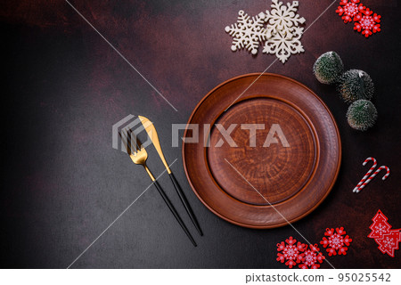 Christmas decoration elements as well as gingerbread on a brown concrete background 95025542