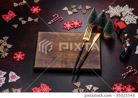 Christmas decoration elements as well as gingerbread on a brown concrete background Christmas decoration elements as well as gingerbread on a brown concrete background 95025548