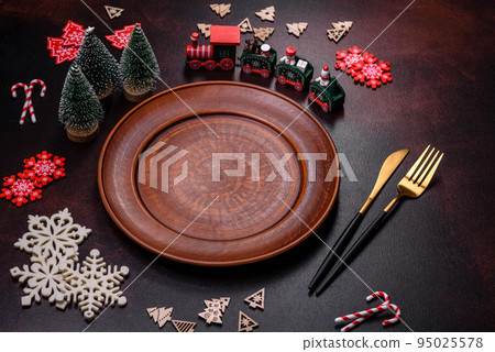 Christmas decoration elements as well as gingerbread on a brown concrete background Christmas decoration elements as well as gingerbread on a brown concrete background 95025578