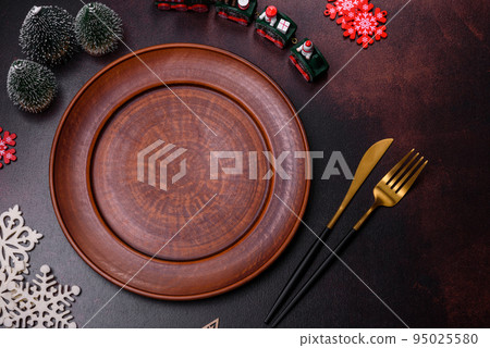 Christmas decoration elements as well as gingerbread on a brown concrete background 95025580