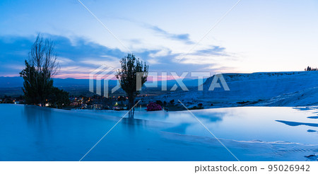 Turkey Trapetical terraces and blue water surface of Hierapolis Pamukkale at dusk 95026942