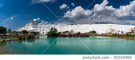 White travertine terraces and blue water ponds in Pamukkale, Hierapolis, Turkey 95026960