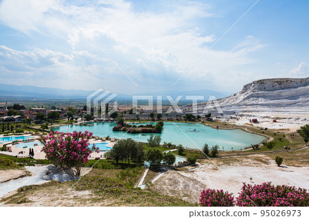 White travertine terraces and blue water pools in Pamukkale, Hierapolis, Turkey White travertine terraces and blue water pools in Pamukkale, Hierapolis, Turkey 95026973