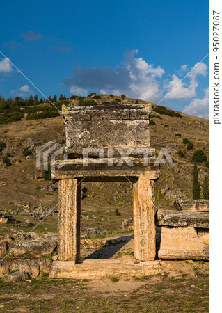 A sarcophagus placed on the gate of the Necropolis, a huge cemetery of Hierapolis ruins in Pamukkale, Turkey A sarcophagus placed on the gate of the Necropolis, a huge cemetery of Hierapolis ruins in Pamukkale, Turkey 95027087