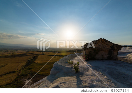 A hut built on a white calcareous terrace in Pamukkale, Hierapolis, Turkey, and a view from the travertine terrace A hut built on a white calcareous terrace in Pamukkale, Hierapolis, Turkey, and a view from the travertine terrace 95027124
