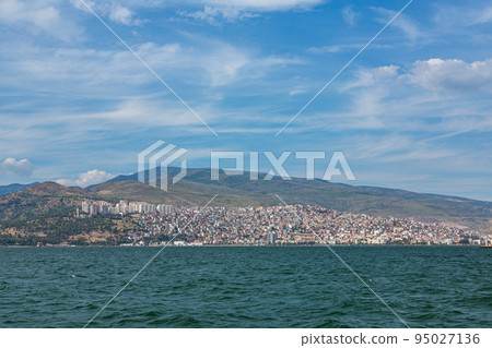 The cityscape and the Aegean Sea that spread out on the hills along the coast of Izmir, Turkey The cityscape and the Aegean Sea that spread out on the hills along the coast of Izmir, Turkey 95027136