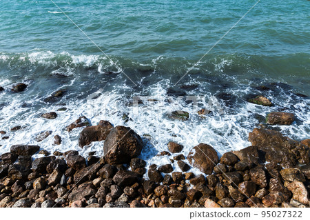 Shore water and wet coastal stones. Summer landscape 95027322