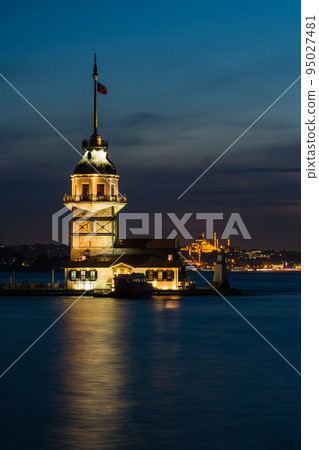 Illuminated Maiden's Tower on a small island in the Bosphorus Strait at night in Istanbul, Turkey Illuminated Maiden's Tower on a small island in the Bosphorus Strait at night in Istanbul, Turkey 95027481
