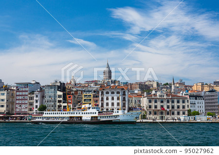 The streets of the new city of Istanbul and the Galata Tower on the hill in the Galata district, Turkey 95027962