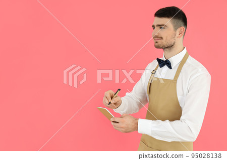 Concept of occupation, young waiter on pink background 95028138