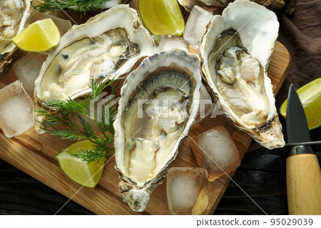 Concept of delicious seafood, oysters, close up 95029039
