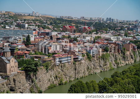 Tbilisi, Georgia - October 1 2022: Beautiful panoramic aerial view of Tbilisi at sunset 95029301