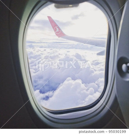view from the airplane window on feather clouds view from the airplane window on feather clouds 95030199