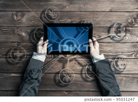 Business workplace with tablet device in female hands and media user interface Business workplace with tablet device in female hands and media user interface 95031247