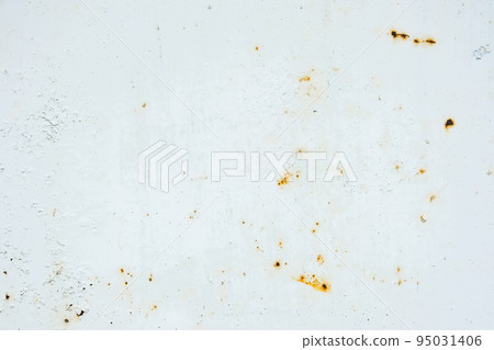 Corrosion of metal. Rust shows through the white Corrosion of metal. Rust shows through the white 95031406