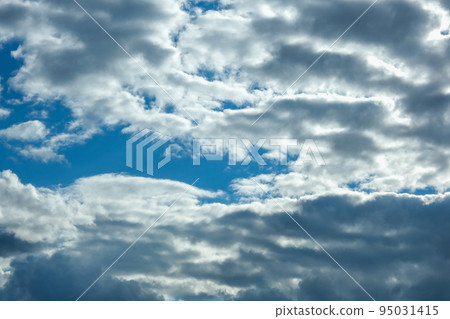 Blue sky with thunderclouds. The sun breaks Blue sky with thunderclouds. The sun breaks 95031415