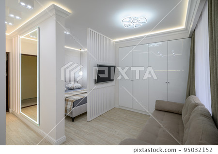 Studio flat interior with living room and bedroom 95032152