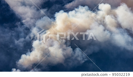 BC Forest Fire and Smoke over the mountain near Hope during a hot sunny summer day. BC Forest Fire and Smoke over the mountain near Hope during a hot sunny summer day. 95032219