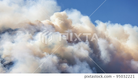 BC Forest Fire and Smoke over the mountain near Hope during a hot sunny summer day. 95032221